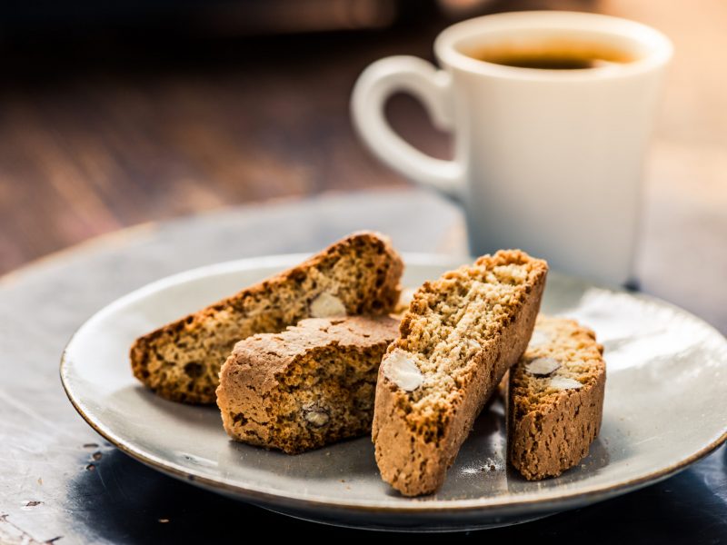Strong coffee served with italian almond cookies cantucci