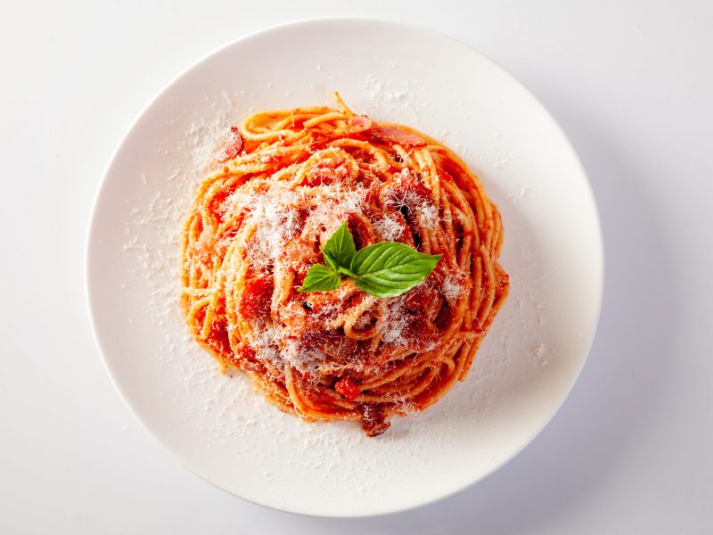 Spaghetti in a dish on a white background